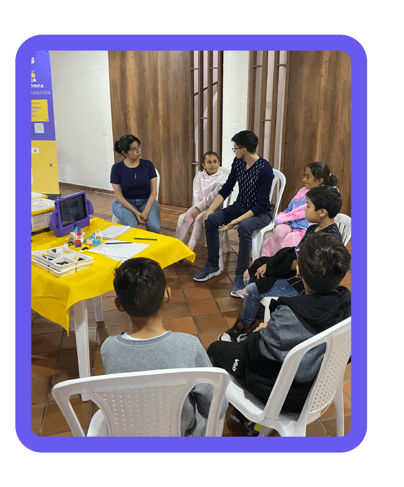 Group robotics class with children learning through play